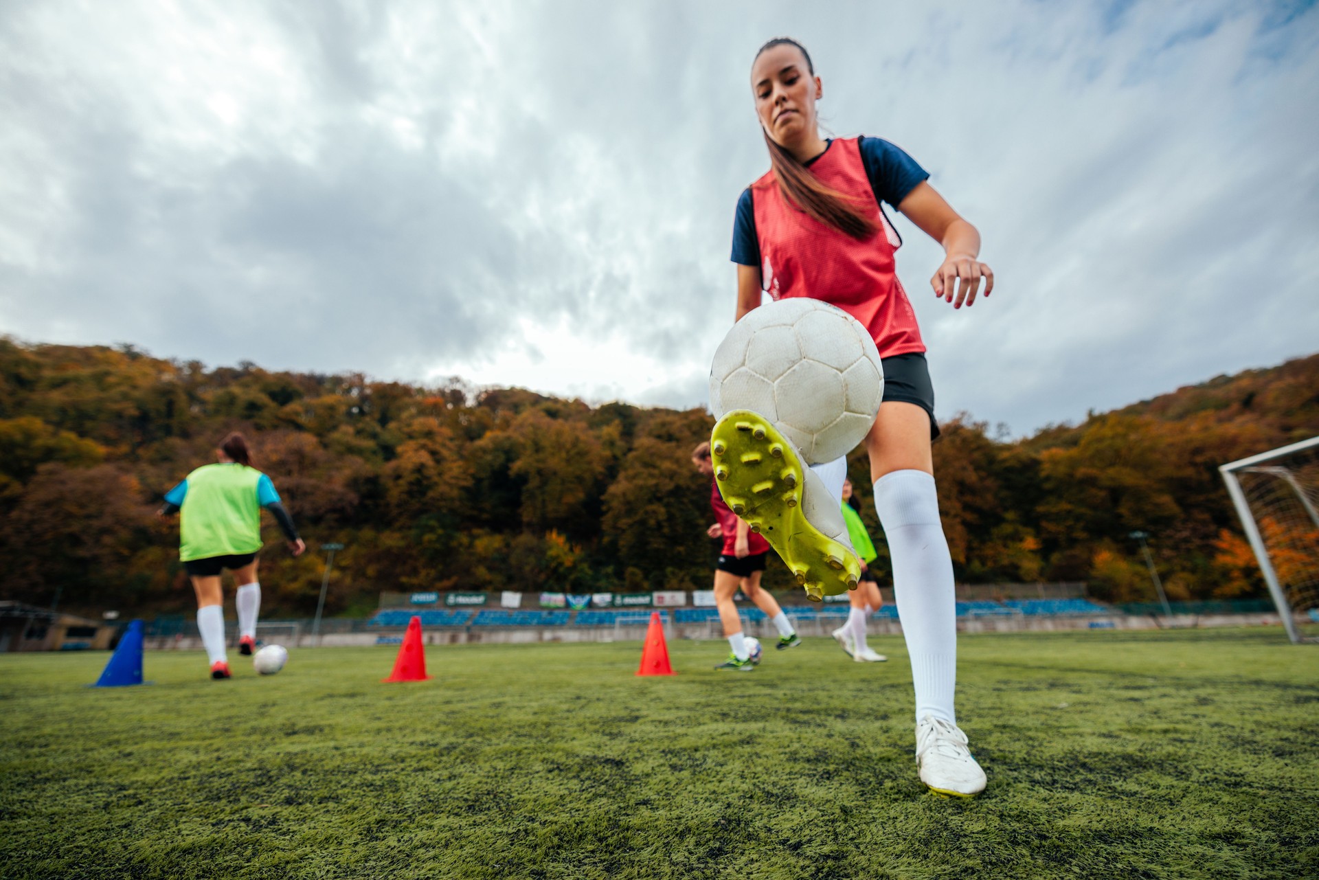 Skilled female soccer players practicing.